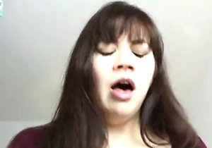 Mom with bangs blows her boy in the kitchen